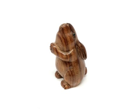 A Japanese carved hardwood netsuke : Praying Rabbit. 
