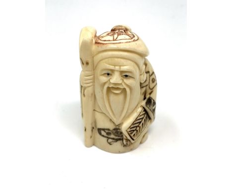 A Japanese carved bone netsuke : Village Elder with Stick. 