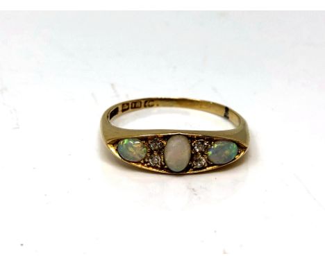 An antique 18ct gold opal and diamond ring, size Q.  CONDITION REPORT: 3.5g