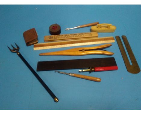 A COLLECTION OF VINTAGE RULERS, BUTTON HOOKS ETC