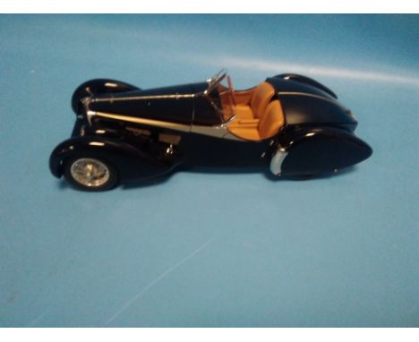 A BOXED CMC BUGATTI 57SC 1938 1:18 SCALE MODEL, The car is in good condition, looks to have been stored in the box from new. 