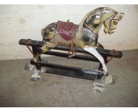 A VINTAGE CHILDREN'S WOODEN PLAY HORSE