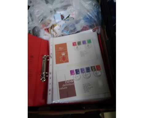 AN ALBUM OF FIRST DAY COVERS TOGETHER WITH A QUANTITY  OF STAMPS