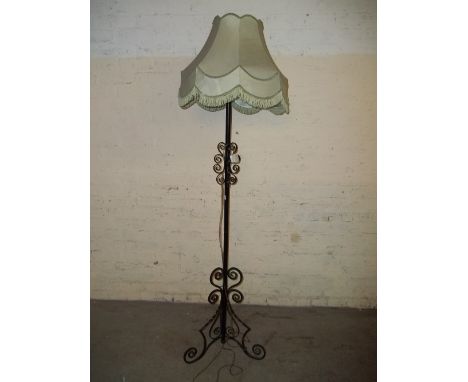 A WROUGHT IRON FLOOR STANDING LAMP