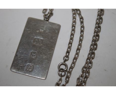 A LARGE HALLMARKED SILVER INGOT ON CHAIN 