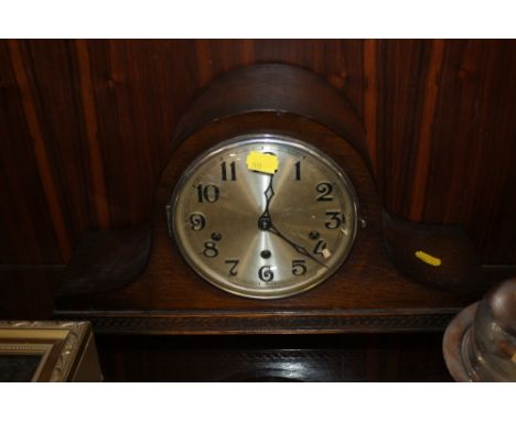 AN OAK NAPOLEON HAT MANTEL CLOCK