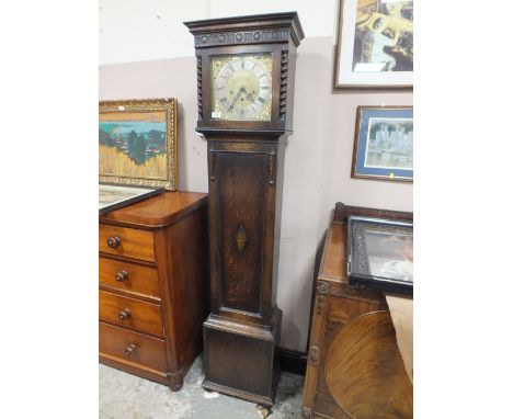 AN EARLY 20TH CENTURY OAK LONGCASE CLOCK WITH BARLEYTWIST DETAIL