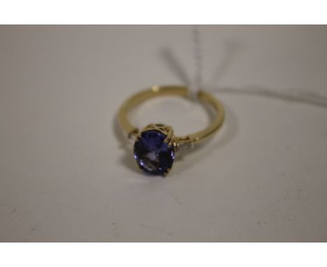 A HALLMARKED 14K GOLD AAA TANZANITE AND DIAMOND RING, the tanzanite being approx 2.6 carats, measures 10 mm x 8 mm, ring size