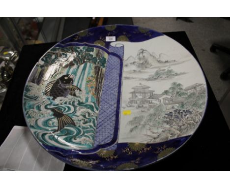 A LARGE ORIENTAL CERAMIC CHARGER A/F