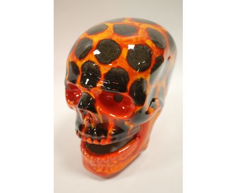 A SIGNED ANITA HARRIS HOT COALS PATTERN CERAMIC SKULL 