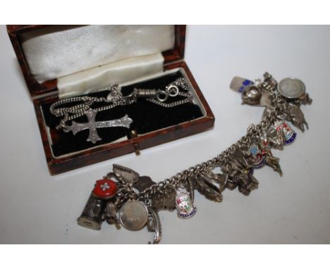 A SILVER CHARM BRACELET TOGETHER WITH A SILVER CROSS PENDANT ON CHAIN 