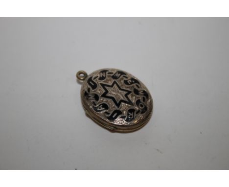 A VICTORIAN WHITE METAL AND ENAMEL LOCKET 