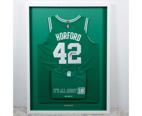 A large, framed Boston Celtics jersey autographed by Al Horford (#42). The display includes a green team shirt reading It's A