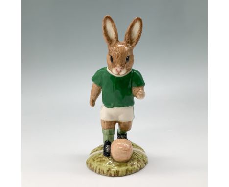 Royal Doulton Bunnykins fine bone china figurine Footballer, DB117. Depicts a bunny in a green jersey and white shorts poised