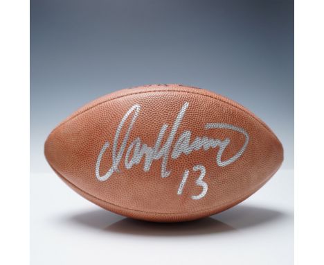 Official Wilson NFL football autographed by Dan Marino, former quarterback of the Miami Dolphins, in metallic-silver ink with