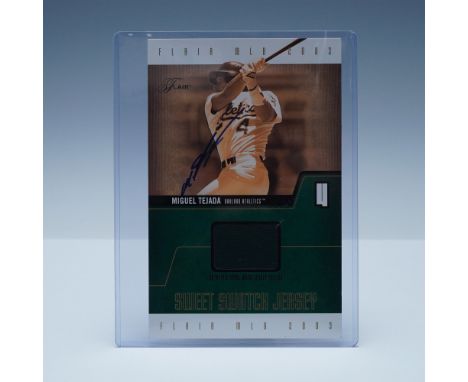 This 2003 Flair Sweet Swatch Jersey card features a game-worn jersey patch from Miguel Tejada, the Oakland Athletics' standou