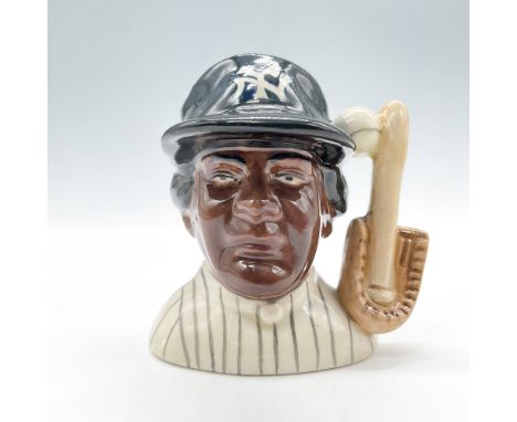 Miniature character jug of a Black New York Yankees player. White baseball, baseball glove, and bat as the handle. Marked: Ro