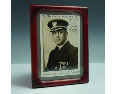 Vintage black and white portrait photograph of Commander Edward Ellsberg, U.S. Navy, housed in a marbled red frame. The image