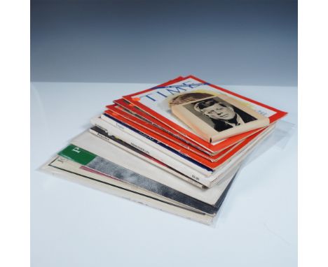 A collection of 12 vintage John F. Kennedy memorabilia items, including magazines, vinyl records, and historical publications
