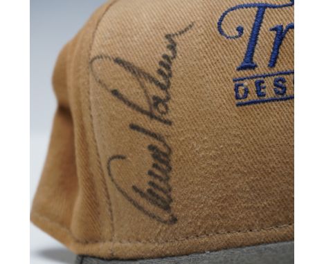 A vintage tan and green golf cap from The Tradition at Desert Mountain, a renowned professional golf tournament, featuring an