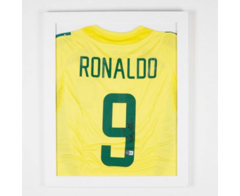 A framed Brazil national team jersey signed by legendary footballer Ronaldo Luis Nazario de Lima. Featuring the iconic yellow