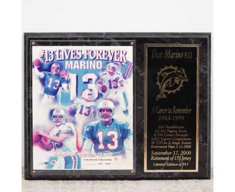 This Dan Marino commemorative plaque honors the legendary Miami Dolphins quarterback's illustrious career from 1983 to 1999. 