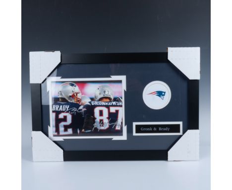 This collectible football piece features a signed photo of NFL players, Tom Brady and Rob Gronkowski, with a New England Patr