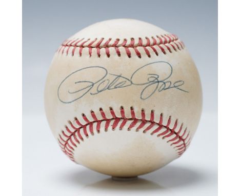 A signed memorabilia set featuring Pete Rose, the all-time MLB hits leader and Cincinnati Reds legend. This display includes 