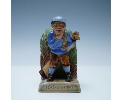 Foozled glazed stoneware bookend modeled by J. B. Harding. The term foozle means to botch or bungle, particularly in golf, wh