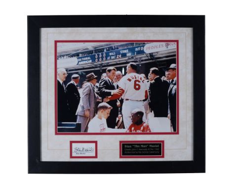 This framed memorabilia piece honors baseball legend Stan "The Man" Musial, featuring a historic photograph of him greeting P