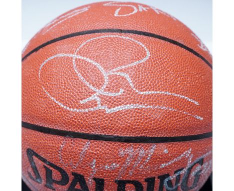 A rare and highly collectible 1995 Miami Heat team-signed Spalding NBA basketball, featuring autographs from key players of t