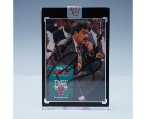 A SkyBox basketball trading card featuring legendary Chicago Bulls coach Phil Jackson, signed by Jackson himself. This vintag