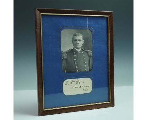 Presented in a deep blue matte and wood frame, this historical display features a black and white photographic portrait of Re
