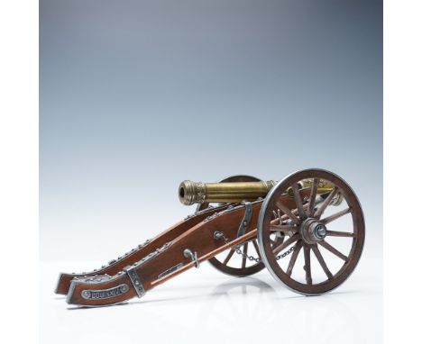 A striking replica of a Louis XIV-era field cannon, featuring exquisite craftsmanship with a richly detailed bronze-toned bar