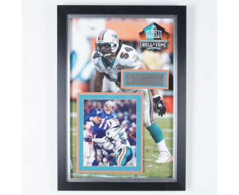 This framed and autographed Miami Dolphins display celebrates the legendary linebacker Zach Thomas, a Hall of Fame inductee a