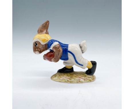 This Royal Doulton Bunnykins figurine, titled "Touchdown Bunnykins," features a bunny dressed in football attire, running wit