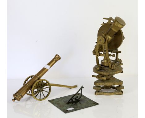 Brass table cannon, L.37cm, together with a sundial, W.15.2 x D.15.2cm.      