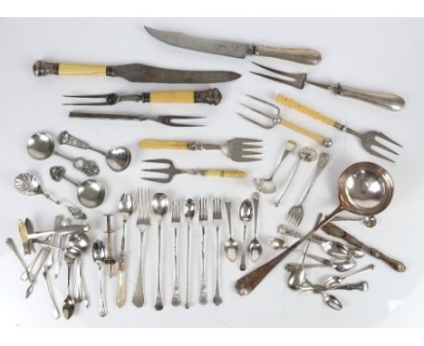 A quantity of silver plated flatware including grape scissors, teaspoons, sifting spoons, Soup ladle, and a pair of knife res