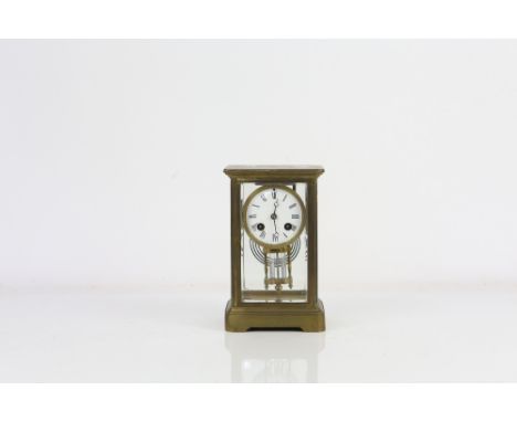 Early 20th century French brass four glass mantle clock, the two train movement striking on a gong, 22cm high.      