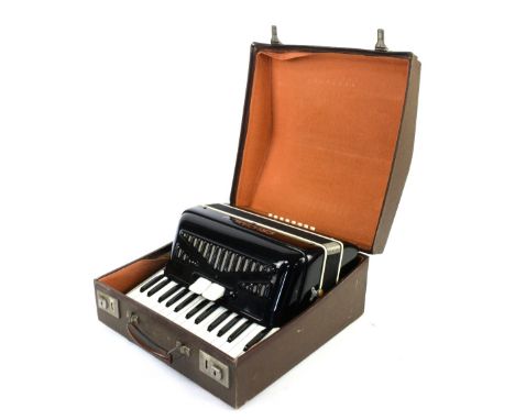 Crucianelli Accordion, marked Made in Italy and numbered 549 to reverse, in hard case with sheet music booklet.      Conditio