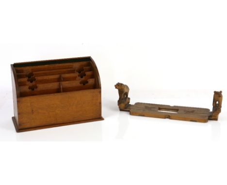 Oak tambour fronted stationery box, and a Black Forest type bear book slide,.      