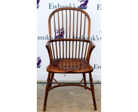 Oak and elm Windsor stick back armchair, with two-tier stick back on turned legs joined by crinoline stretcher.      