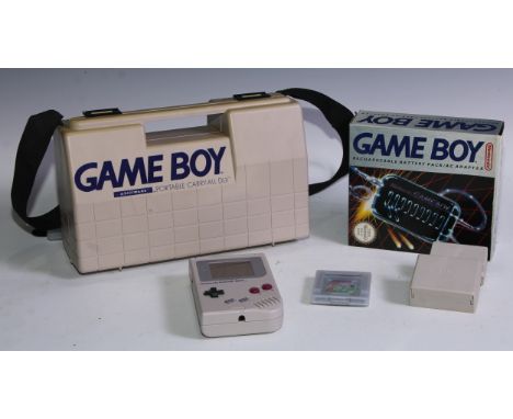 Retro Gaming - a Nintendo Game Boy Model No. DMG-01 with portable carry-all DLX case; Nuby game light plus; Tetris and Bandai