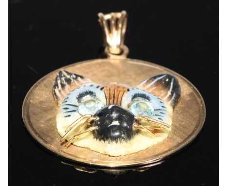 A 14ct gold cat pendant, enamel face, stone set eyes, 4cm in diameter, 22.7g gross 