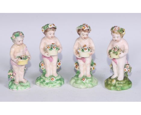 A harlequin set of four Derby patch mark figures, of putti, each modelled with a flowering basket, the tallest 11cm high, c.1