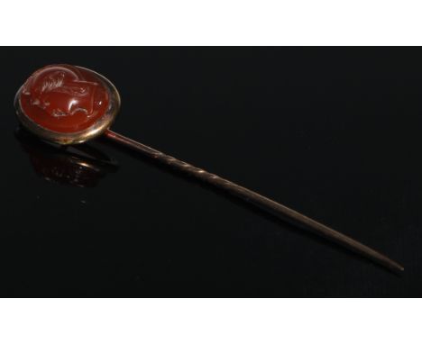 A 19th century carnelian stick pin, oval intaglio portrait as a warrior profile, to sinister, unmarked yellow metal mount, 5.