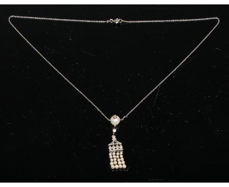 An Art Deco diamond and seed pearl fringe pendant, with single larger pearl, seven old cut diamonds and four seed pearl fring