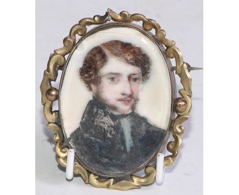 English School, an early 19th century, an oval portrait miniature on ivory, young gentleman in black overcoat, 4.5cm x 3.5cm,