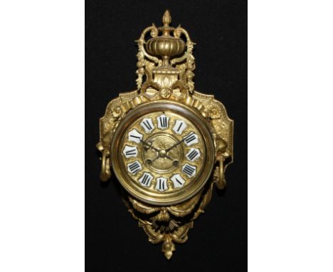 A French Louis XIV Revival gilt metal cartel clock, 11.5cm circular dial inscribed with Roman numerals, upon shaped reserves,