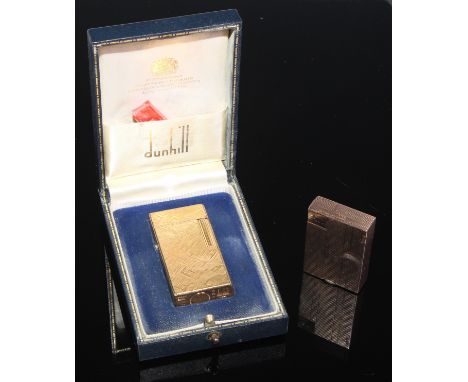 A Dunhill 70 cigarette lighter, FY835, textured gold coloured body, flick lid, roll striker, boxed with flints slip;  another